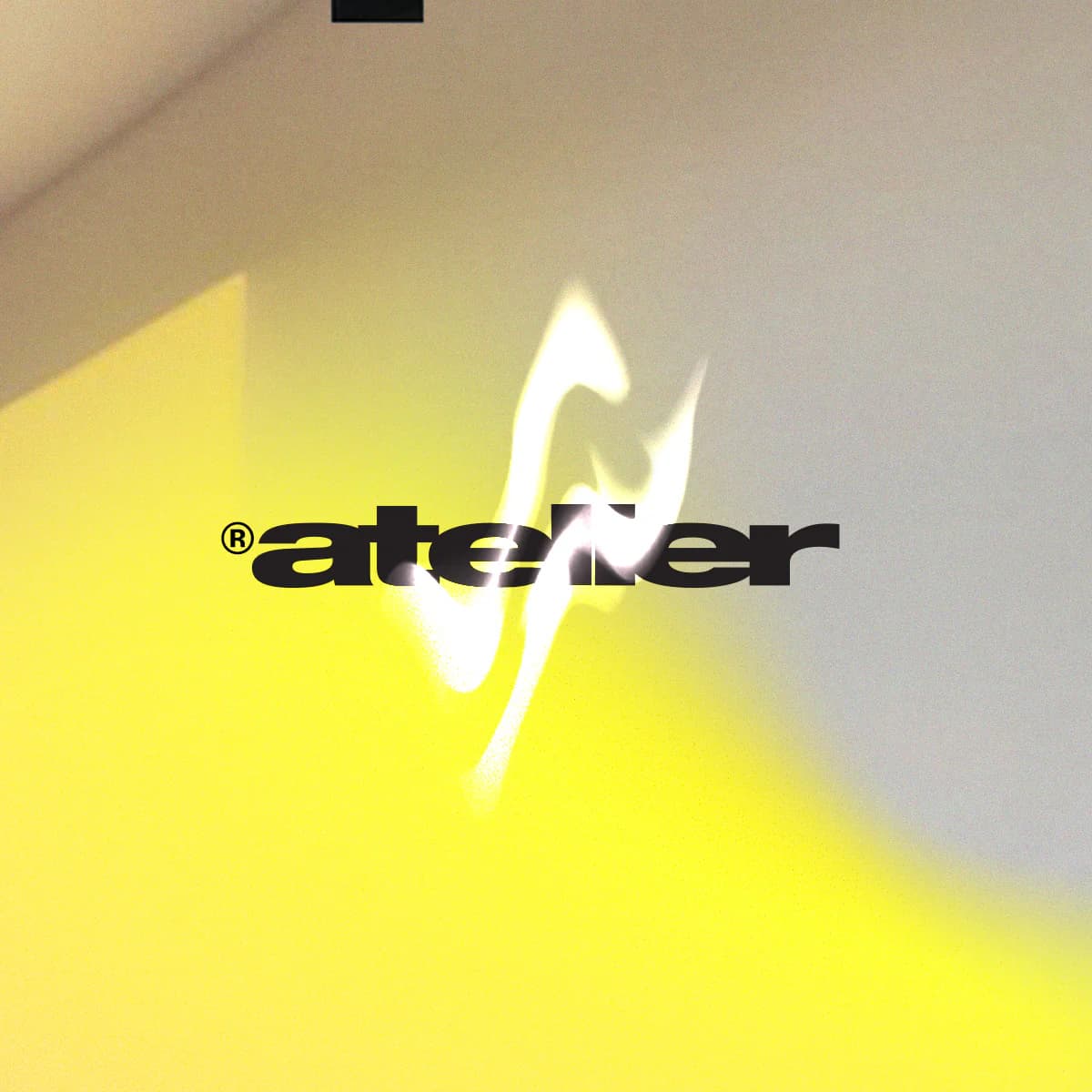 Atelier wordmark over a blurred fluorescent yellow photograph