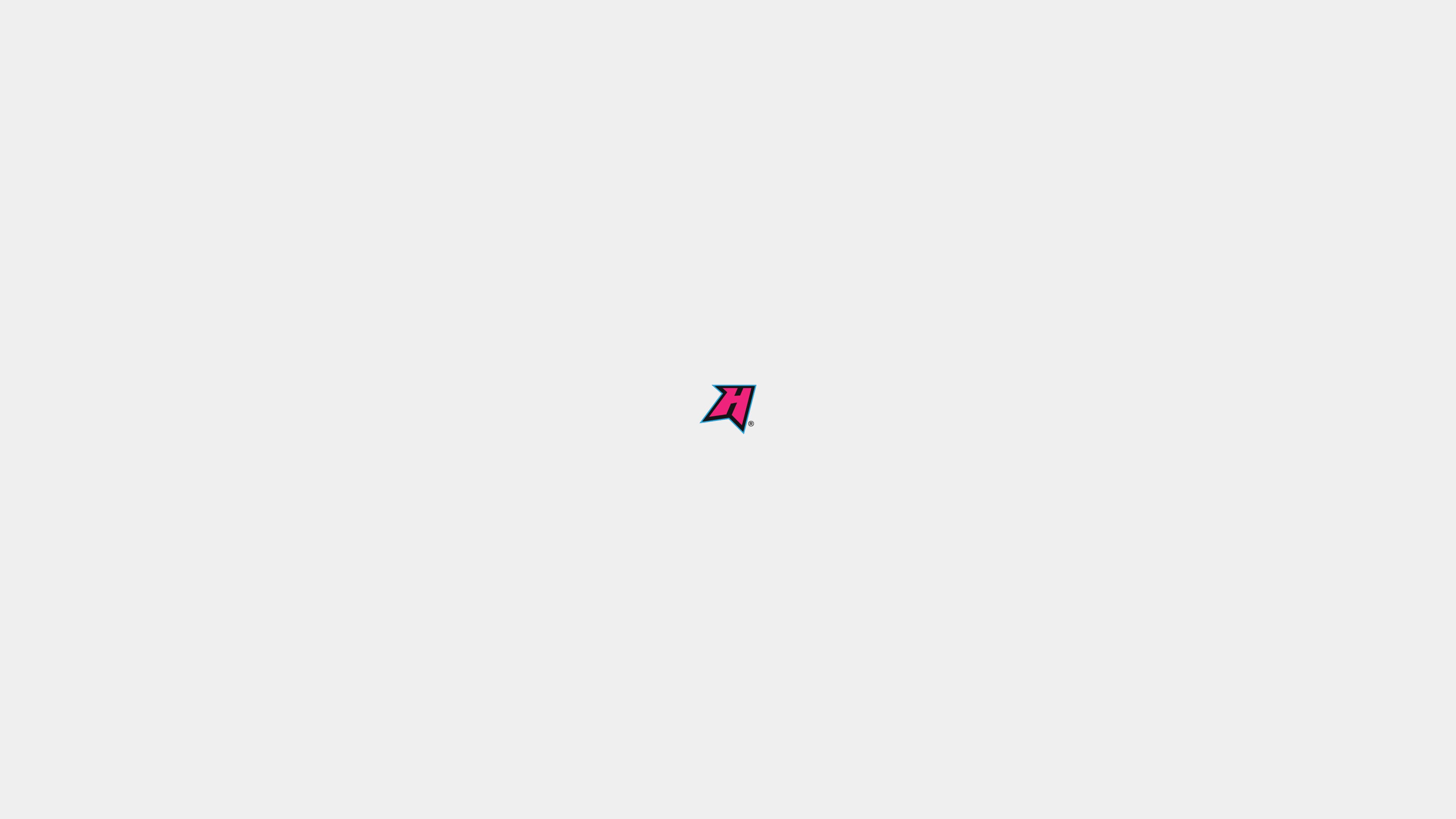 Small pink and blue angular mark centered on white